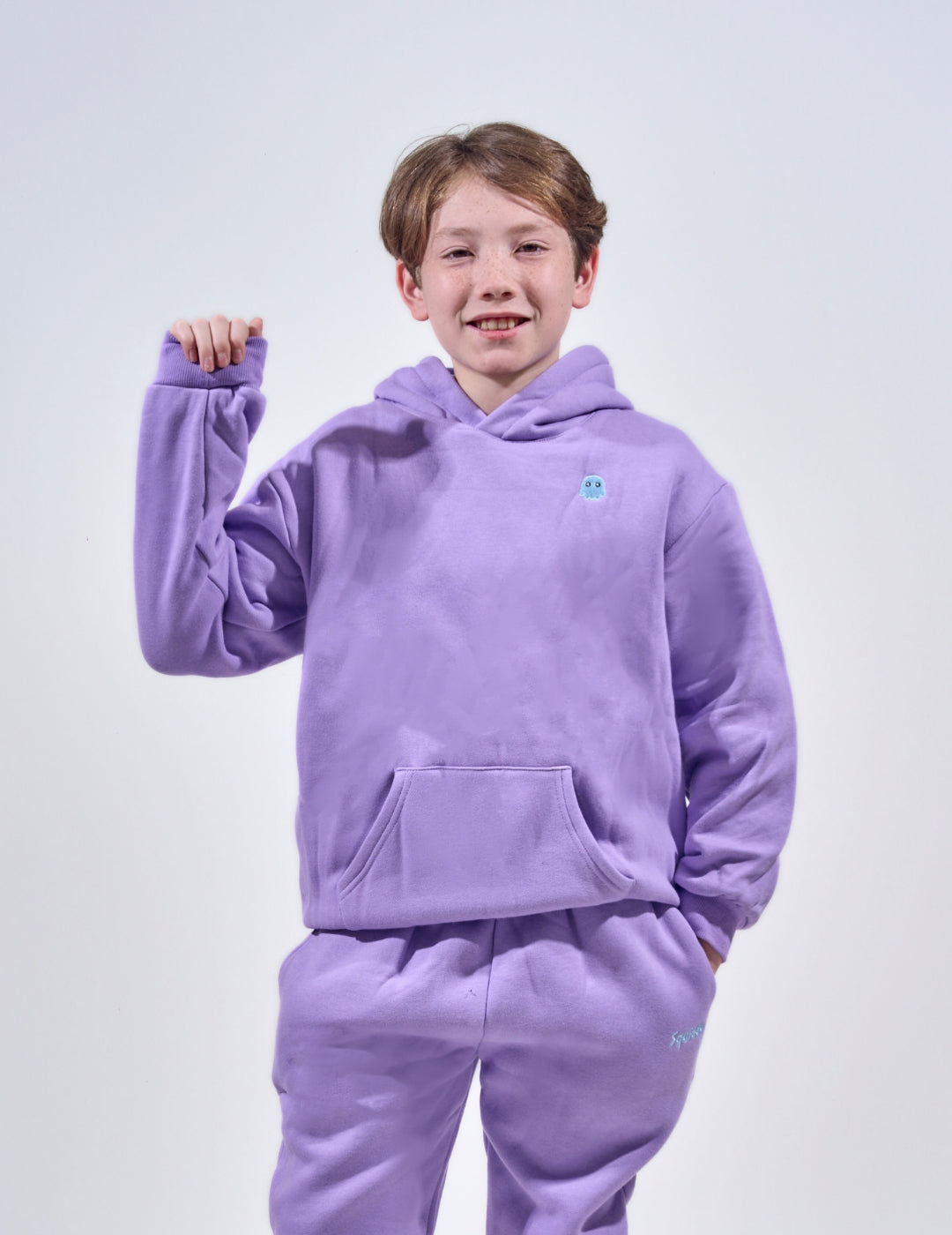 The Classic Kids Squiddy Hoodie in Lavender Purple with boy model- Weighted Kids Hoodie with built-in squishies in the cuffs
