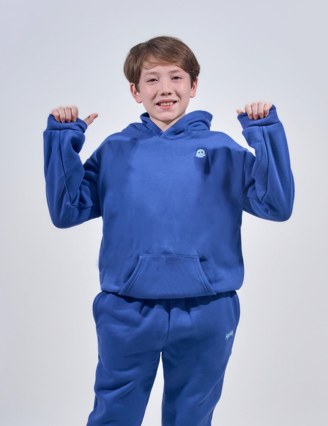 The Classic Kids Squiddy Hoodie in NavyBlue with boy model- Weighted Kids Hoodie with built-in squishies in the cuffs 2