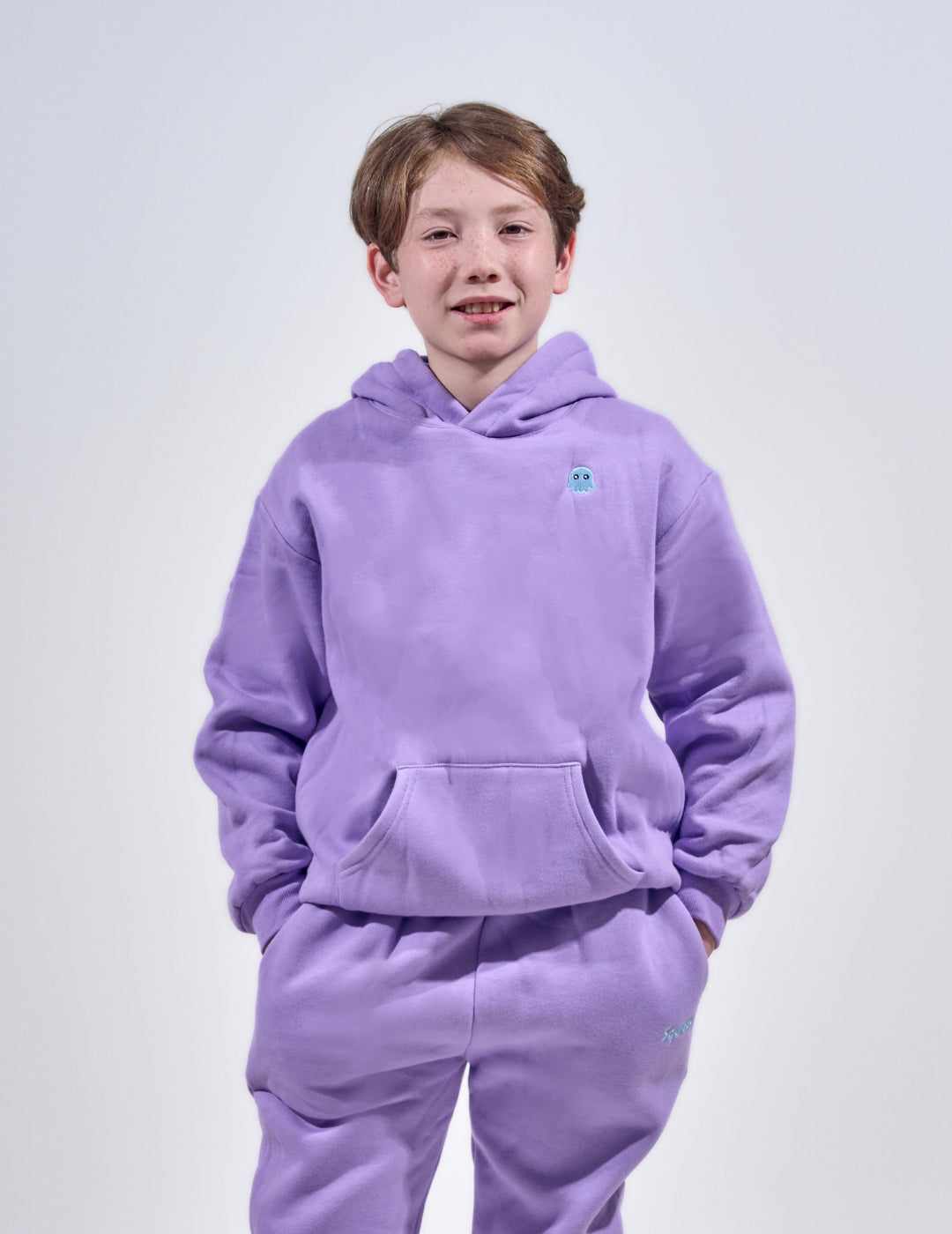 The Classic Kids Squiddy Hoodie in Lavender Purple with boy model- Weighted Kids Hoodie with built-in squishies in the cuffs  2