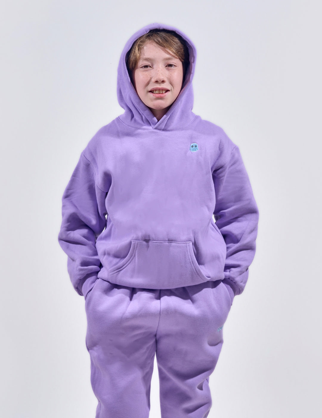 The Classic Kids Squiddy Hoodie in Lavender Purple with boy model- Weighted Kids Hoodie with built-in squishies in the cuffs 4