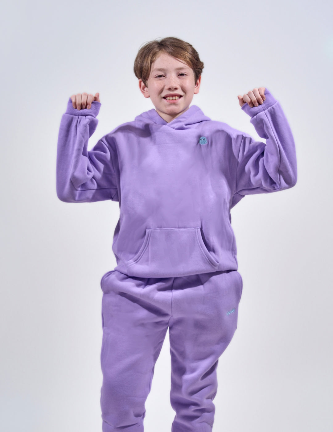 The Classic Kids Squiddy Hoodie in Lavender Purple with boy model- Weighted Kids Hoodie with built-in squishies in the cuffs  3