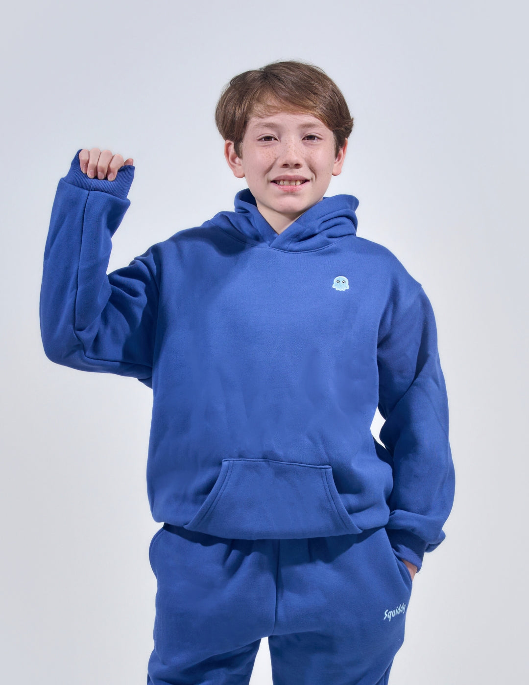 The Classic Kids Squiddy Hoodie in NavyBlue with boy model- Weighted Kids Hoodie with built-in squishies in the cuffs 