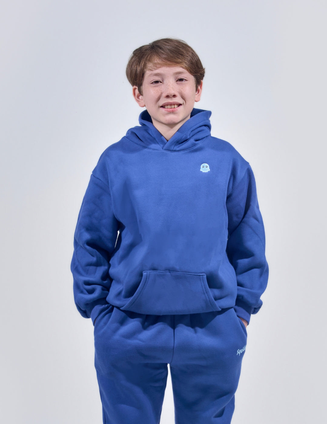 The Classic Kids Squiddy Hoodie in NavyBlue with boy model- Weighted Kids Hoodie with built-in squishies in the cuffs 3